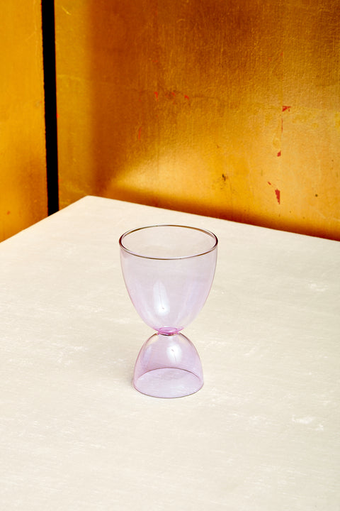 A lavender cocktail glass.