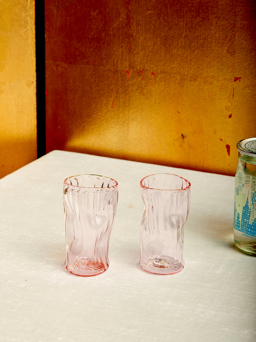 A pink pair of sake glasses by Iannazzi Glass.