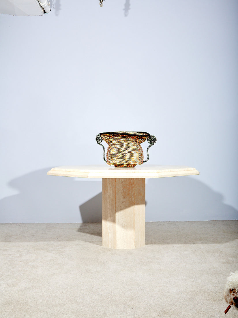 Giusti Urn on top of the Travertine Dining Table.
