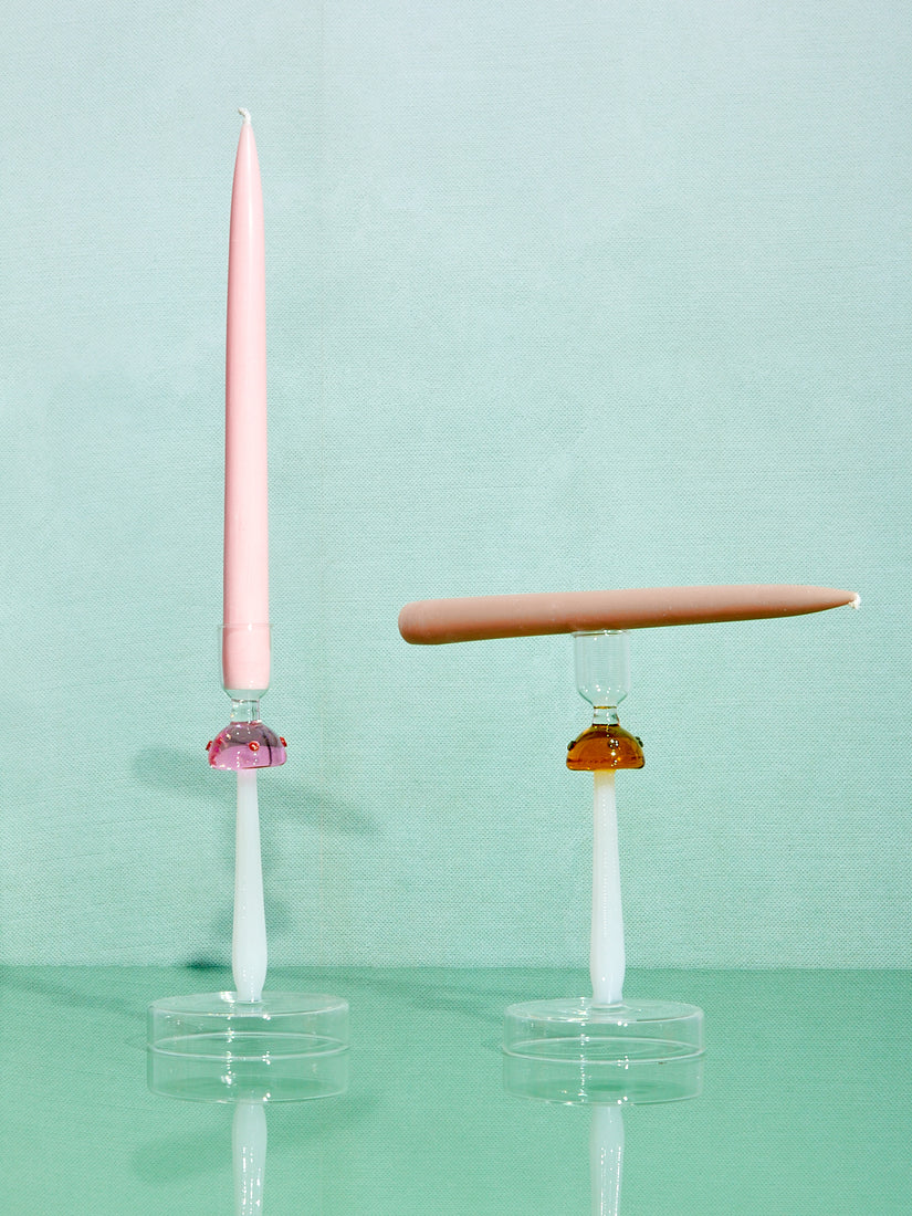One pink and one amber Mushroom Candle Holder by Ichendorf Milano with taper candles.