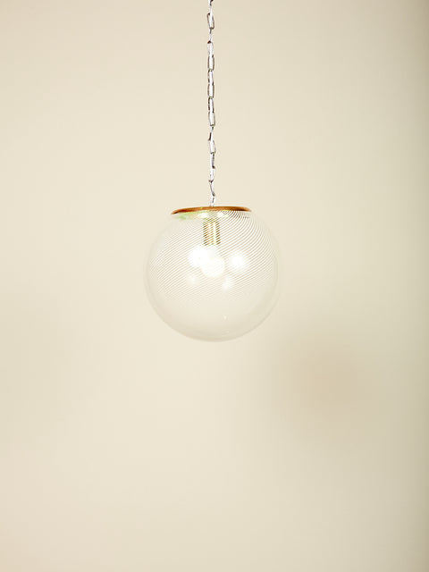 Vintage Lattimo Glass Pendant Lamp with iconic white swirl globe and brass hardware.