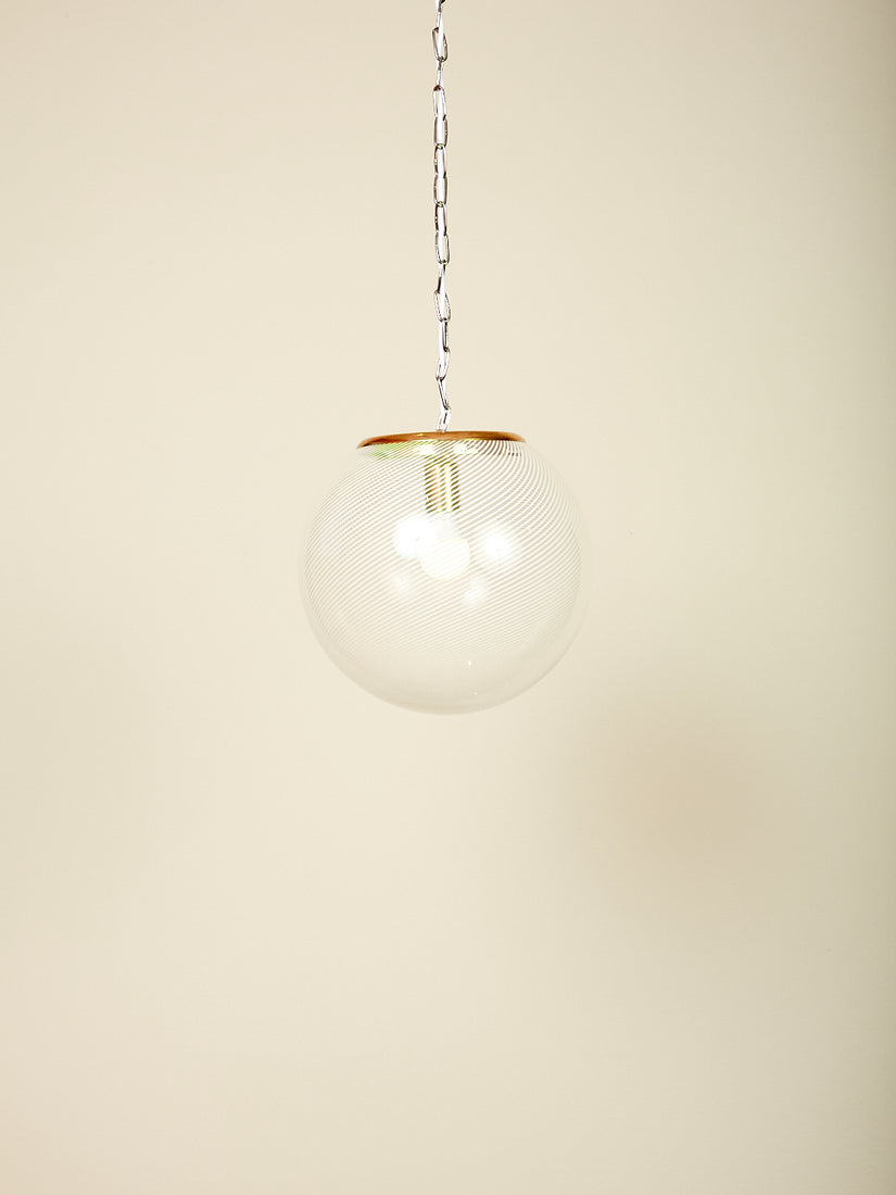 Vintage Lattimo Glass Pendant Lamp with iconic white swirl globe and brass hardware.