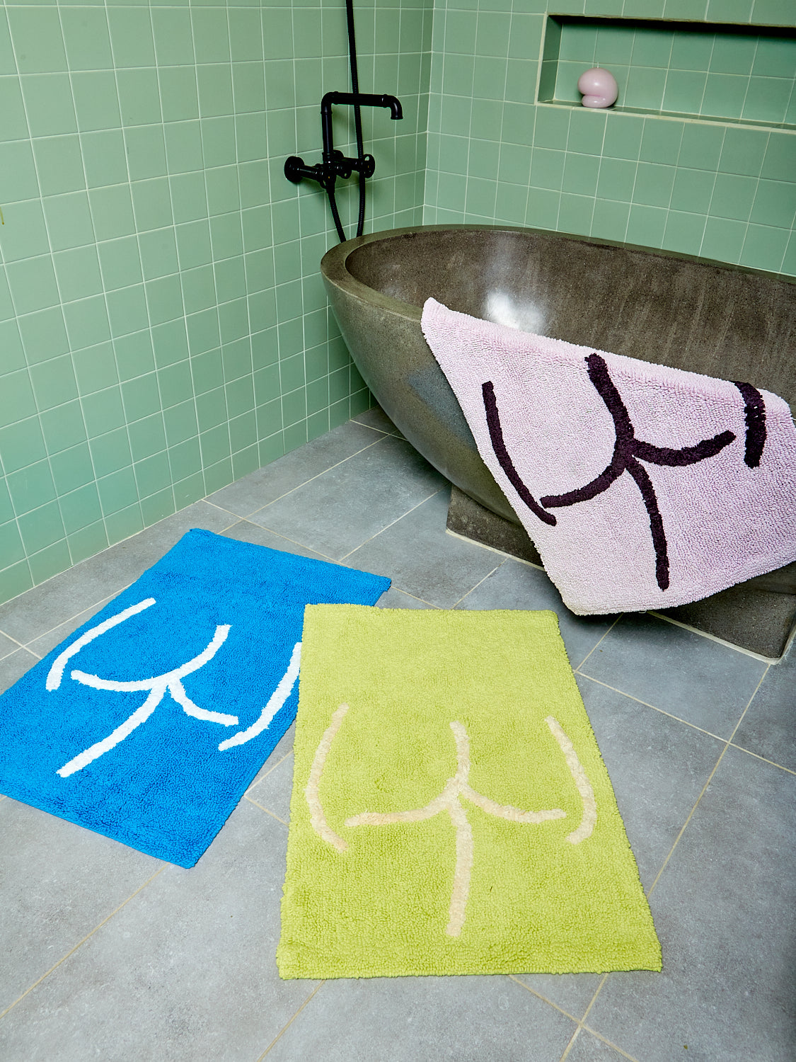 Tushy Bath Mat's in blue, lavender, and highlighter by Cold Picnic.