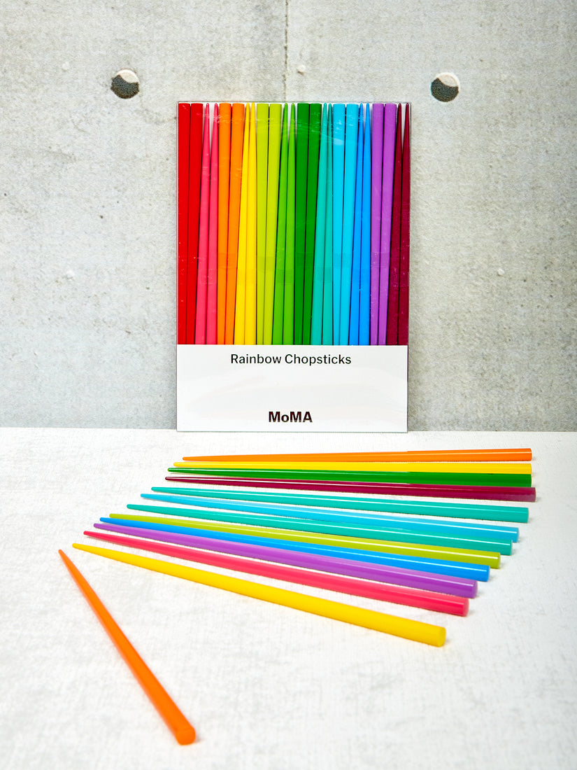 Rainbow Chopsticks by Moma laid out in front of a full set in box.