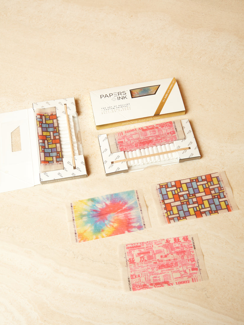 Rolling Paper Kits by Papers + Ink in three different patterns. One sheet from each pattern is laid out.