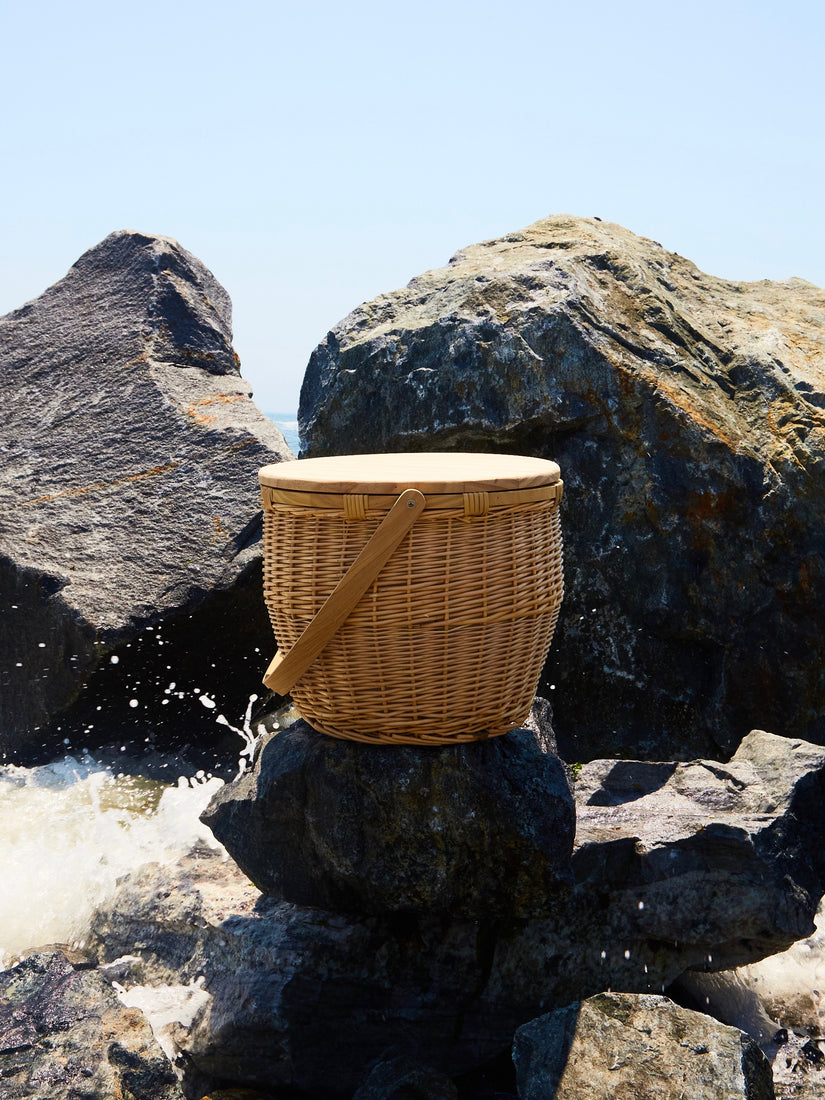 Picnic Cooler Basket by Sunnylife on large rocks at the Rockaway Beach.